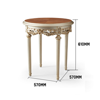 Table d'appoint ronde de luxe avec plateau en marbre orange et cadre en bois sculpté à la main avec feuilles d'or pour une décoration classique de la maison