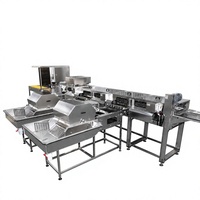 Machine de calibrage et de pelliculage des œufs de cane en acier inoxydable de qualité alimentaire pour ligne de traitement des œufs destinée aux usines d'œufs conservés