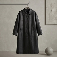 Manteau long trench-coat noir mat en cuir de vache véritable pour femme, à revers crantés, simple boutonnage, poignets ajustables, fente arrière, coupe ample