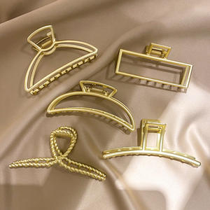 Fermaglio per Capelli in Metallo Texturizzato con Design a Perla, Grande Clip Versatile per Donna - Product Image 1