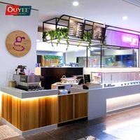 Comptoir de café en bois avec façade vitrée et éclairage LED pour usage commercial