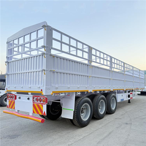 Semi-remorque cage en acier jaune à 3 essieux, conception à piquets, dimensions 9,5x2,5x3,5m, charge utile 5001-10000 kg, marque - Product Image 1