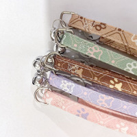 Collier pour animaux de compagnie avec clochette motif empreinte de patte, en coton et polyester, doux, réglable, avec boucle de sécurité, pour chatons, chiots et chiens de petite et moyenne taille