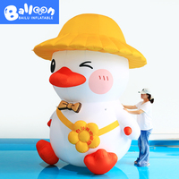 Modèle de canard gonflable personnalisé avec chapeau de paille jaune pour la décoration d'événements festifs, la publicité commerciale, les événements de carnaval