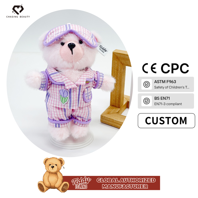 Pyjama à carreaux roses et blancs avec motif ours en peluche.