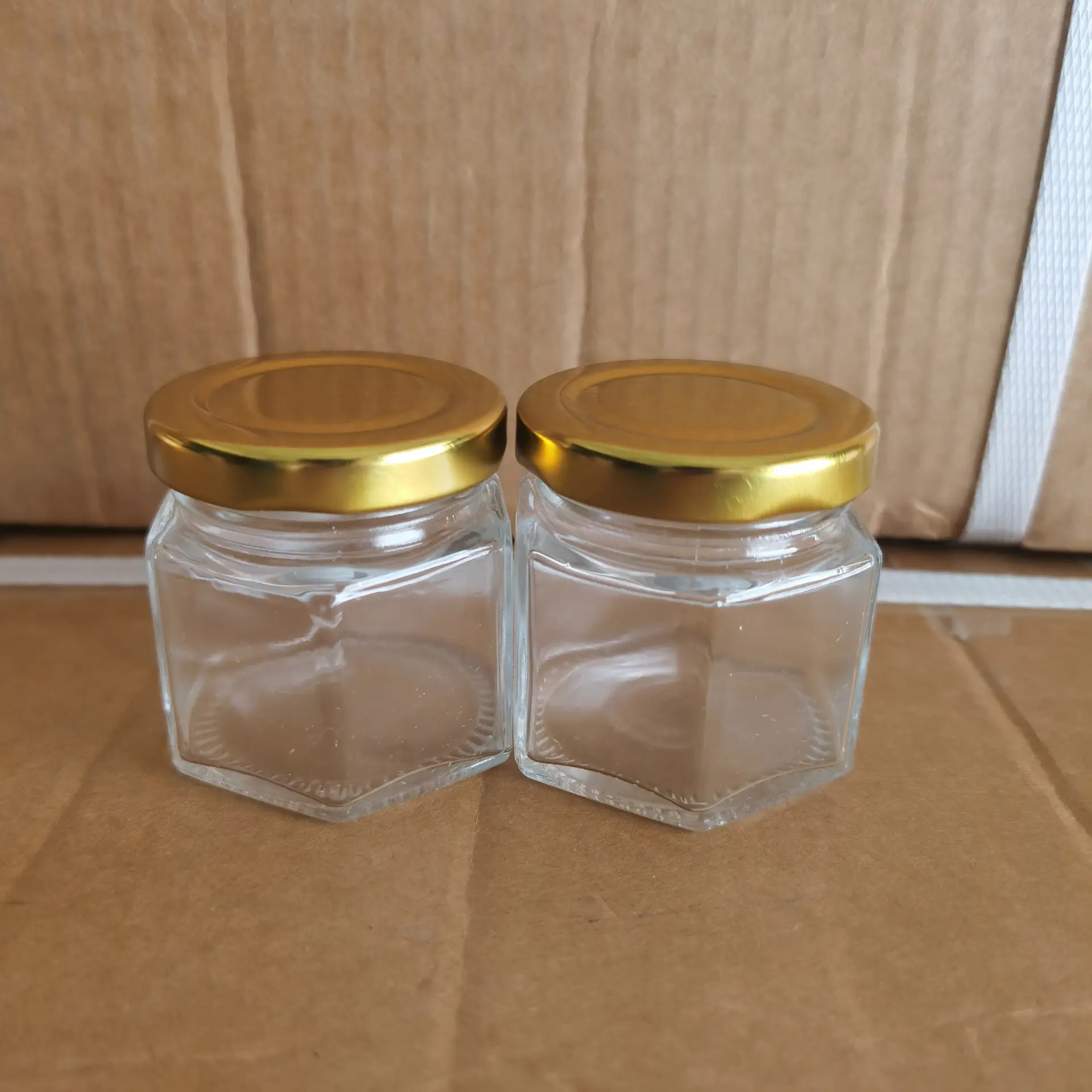 Custom 45ml empty mini hexagon Chilli Honey Food Packaging glass jar with gold lids cheap for sale
