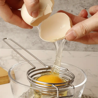 Nouveau gadget de cuisine de séparateur d'oeufs intelligent commercial en acier inoxydable pour la cuisson des outils d'oeufs de filtre à oeufs jaunes et blancs
