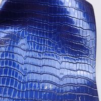 Tissu en cuir artificiel en PVC de crocodile doux et brillant de 0.7mm d'épaisseur pour emballage décoratif de tapis de sac à main de sac de siège de voiture