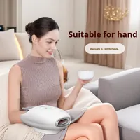 Masseur pour les mains avec fonctions de pression par airbag, chauffage, soufflage et pétrissage pour la relaxation musculaire et articulaire