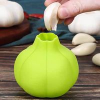 Accessoire de cuisine domestique efficace: éplucheur d'ail rond en silicone de qualité