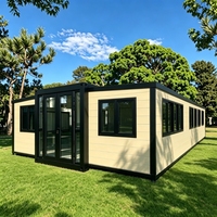 Maison conteneur extensible ignifuge A1, cadre noir crème, préfabriquée en forme de L # 1 Vendeur mondial Livraison en 10 jours ADU