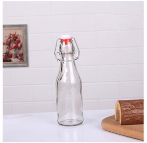 Jiuyi Venta <span class=keywords><strong>caliente</strong></span> botella <span class=keywords><strong>de</strong></span> vino <span class=keywords><strong>de</strong></span> vidrio transparente sellado <span class=keywords><strong>agua</strong></span> <span class=keywords><strong>casera</strong></span> vino jugo botella redonda cuadrada sellada botella <span class=keywords><strong>de</strong></span> vidrio vacía - Product Image 6