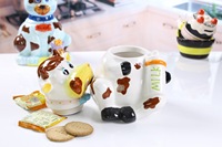 Vente en gros de bidon de stockage d'aliments en céramique avec peinture sur grande vache pot à biscuits dolomite