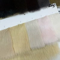 Tissu en fausse fourrure shaggy multicolore mi-longue 100 % polyester pour la production de vêtements de mode