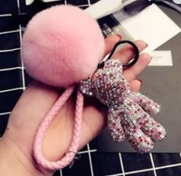 Offre Spéciale Mode De Luxe En Cuir Tressé Brin Plein Cristal Ours Pendentif Porte-clés Moelleux Pompon Porte-clés