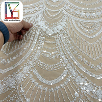 Tissu de robe de mariée africaine haut de gamme en dentelle perlée blanche française avec des paillettes
