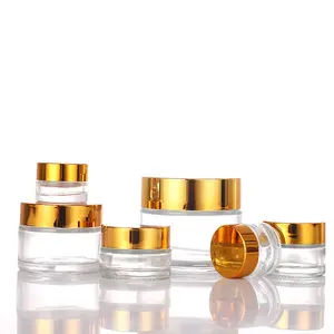 Toples krim mata wajah bulat, toples kaca bening 10ml 30ml 50ml dengan sendok kustom dengan tutup emas