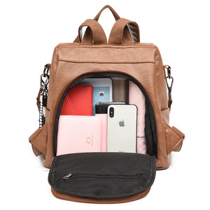 Mochila de cuero suave con diseño de lazo, convertible en bolso cruzado para damas, ideal para el día a día con un lindo colgante. - Product Image 3