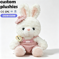 Peluche Lapin Blanc Doux en Gros avec Nœud Rose et Salopette en Velours Côtelé – Cadeau d'Anniversaire pour Fille