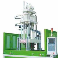 Machine de moulage par injection verticale à double table coulissante pour la fabrication de fiches et l'overmoulage de connecteurs électriques en plastique