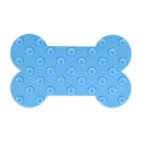 Tapis de léchage en silicone de qualité alimentaire à bords surélevés pour l'alimentation lente et l'entraînement des chiens, en forme d'os