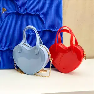 Nuevo diseñador de logotipo personalizado bolso Mini en forma de chico bolsos de mano niñas pequeñas corazón monedero lindo hombro bandolera de lujo Pvc mujeres individuales