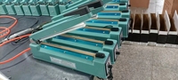 Machine manuelle de cachetage de film plastique de main de scellant de chaleur d'impulsion de prix bon marché d'usine