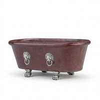 Baignoire ovale autoportante en marbre rouge veiné avec pieds en forme de tête de lion et pieds argentés pour maison et hôtel