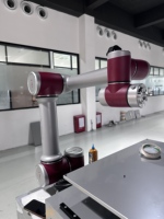 Système de chargement et de déchargement robotisé pour machine de moulage par injection, robot de préhension et de placement pour pièces estampées