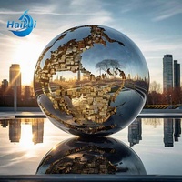 Sculpture de globe terrestre en acier inoxydable de grande taille pour la décoration de complexe hôtelier à thème extérieur