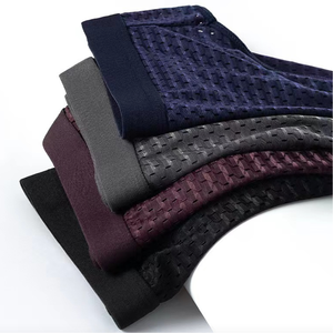 Sous-vêtements triangulaires pour hommes, respirants, sans couture, amples, à séchage rapide, en maille ajourée pour l'été - Product Image 1