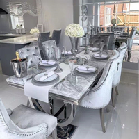 Table à manger de luxe moderne haut de gamme au design nordique pour salle à manger ou restaurant, base en acier inoxydable doré, plateau en marbre noir pour villa