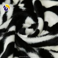 Fabrication chinoise Polyester fausse fourrure tissu fausse fourrure tissu de conception animale pour coussin