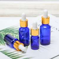 Approvisionnement d'usine 30ml vide verre bleu bouteille or compte-gouttes pompe pulvérisateur échantillon gratuit diplômé Pipette 10ml 20ml 50ml huile essentielle