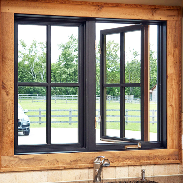 Black aluminium casement window with divided-light muntin grid, one sash cranked open