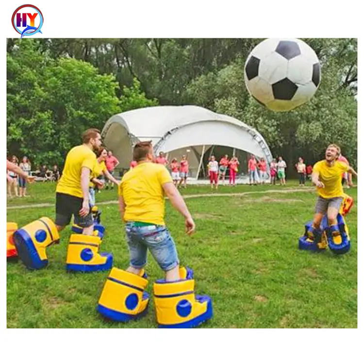 Botas de velocidad de construcción de equipos inflables, juegos deportivos gigantes de PVC, zapatos de fútbol inflables, divertidos juegos de fútbol