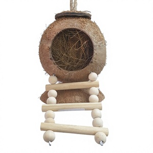 Abri pour oiseaux en coquille de noix de coco naturelle avec perchoir en bois, jouet écologique pour oiseaux fabriqué au Vietnam - Product Image 1