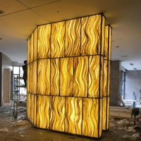 Revêtement mural en pierre artificielle rétroéclairée de luxe moderne, écologique et ignifuge pour la réception d'hôtel