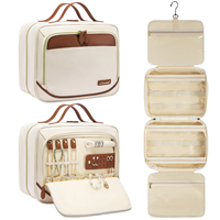 Sac de voyage en PVC pour maquillage, vente en gros d'usine, poignée souple, capacité moyenne, tendance, résistant à l'eau, fermeture éclair, sac pour essentiels
