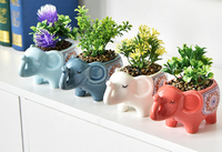 Pot de fleur en céramique émaillée en forme de petit éléphant mignon pour la maison et le jardin en gros