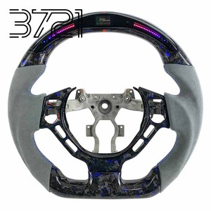 พวงมาลัยคาร์บอนไฟเบอร์ LED สำหรับ Nissan GT-R R35 สีน้ำเงิน คาร์บอนฟอร์จ หนังแท้ พวงมาลัยแต่งสำหรับรถแข่ง ปี 2008-2025 - Product Image 1