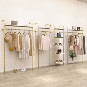 Listo para enviar, estante de ropa de Metal bonito a la moda, estante de ropa montado en la pared dorado de acero inoxidable para exhibición de <span class=keywords><strong>tienda</strong></span> de mujeres Boutique - Product Image 4