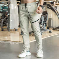 Vêtements de sport Pantalons de sport de gym pour hommes Pantalons cargo imperméables de couleur unie Pantalons maigres élégants Pantalons d'entraînement de fitness secs