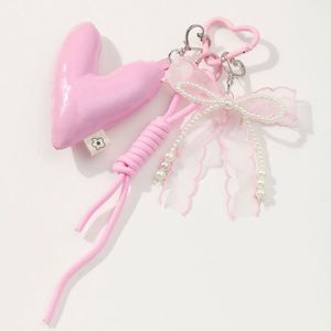 Wholesale Popular Sweet and Fashionable Keyring Pink Series Bow for Love Imitation Pearl DIY Heart Shaped Metal Keychain Pendant - Product Image 4