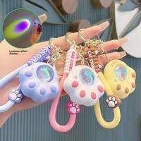 Porte-clés PVC Lumineux Créatif Patte de Chat Effet Coucher de Soleil pour Voiture et Sac à Dos