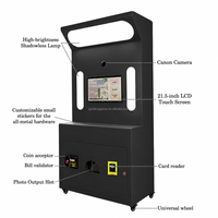 Imprimante portable noire mate à écran tactile avec appareil photo et Bluetooth pour impression instantanée, idéale pour la location en cabine photo lors de fêtes, événements et centres commerciaux