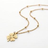 Collier QIAOREN 12896 plaqué or 18 carats, trèfle à quatre feuilles, en acier inoxydable, étanche et inaltérable, avec chaîne satellite porte-bonheur