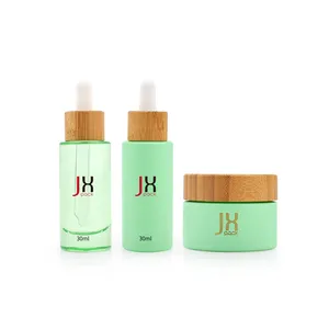 Personalizzato 30 ml 50ml 60ml 80ml siero per la cura della pelle imballaggio cosmetico bottiglia contagocce vuota rotonda in vetro verde con bambù