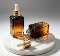 Flacon carré en verre ambré de 10 ml, 15 ml, 20 ml, 30 ml, 50 ml, 100 ml en stock avec compte-gouttes pour l'emballage d'huiles capillaires, de sérums cosmétiques et d'huiles essentielles