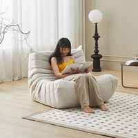 Canapé lounge moderne 3 places sans accoudoirs, fauteuil de salon style pouf moelleux pour meuble d'appoint